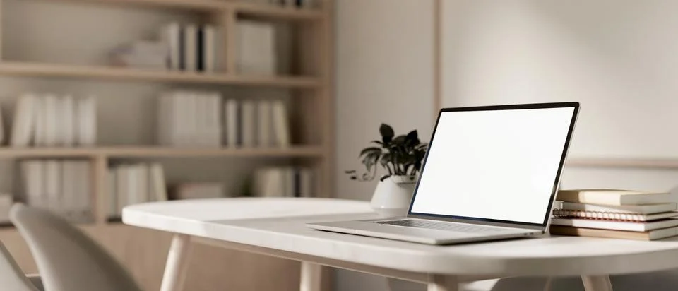 A close-up image of a laptop computer with a white-screen mockup on a table.. Stock Illustration