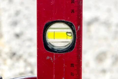A close up image of a leveling tool being used Stock Photos