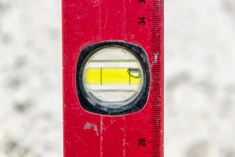 A close up image of a leveling tool being used Foto stock