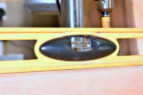 A close up image of a leveling tool being used Фото