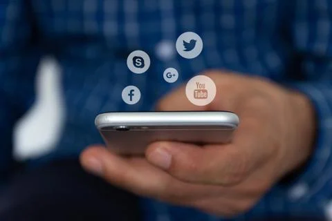 Close-up image of male hands using a mobile smartphone with social networking Stock Photos