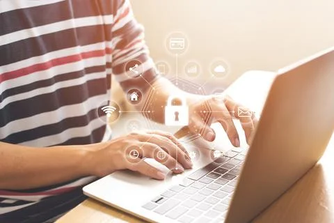 Close-up image of male hands using computer laptop with icon graphic cyber se Foto stock