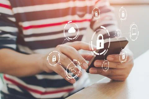 Close-up image of male hands using mobile smartphone with icon graphic cyber  写真素材