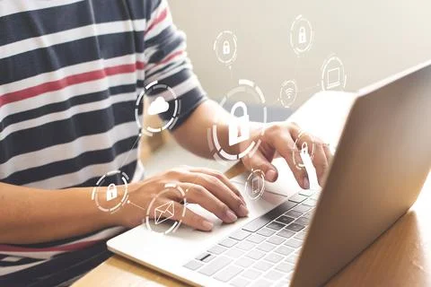 Close-up image of male hands using computer laptop with icon graphic cyber se Stock Photos