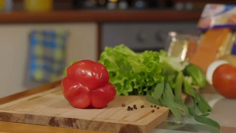 Close Image With Man Hands In Kitchen Cutting red bell pepper in Fresh Slices Video stock 126631311