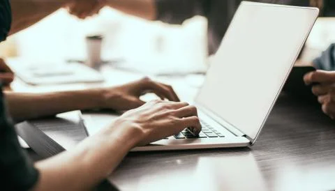 Close up. image of a man working on an office laptop . Stock Photos