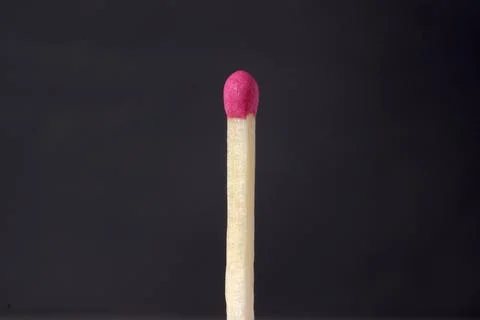 Close-up image of a match on a dark background. Foto stock