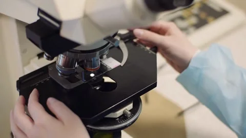 Close up image of a microscope for laboratory research on the Corona Virus Stock Footage 336582875