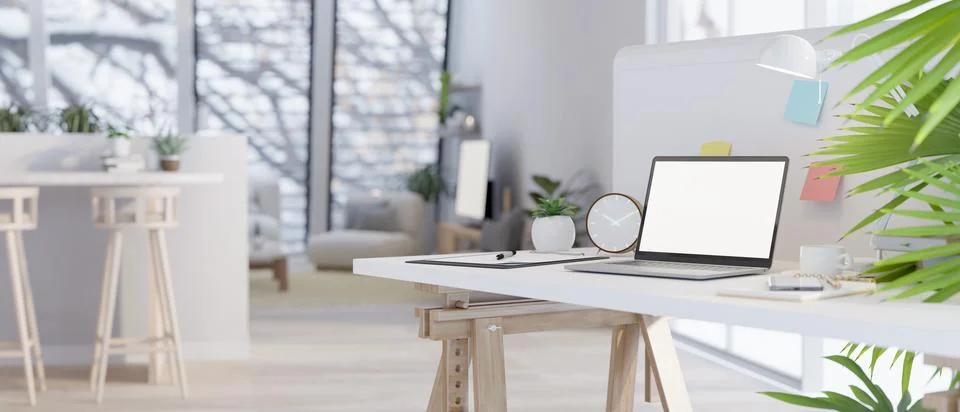 Close-up image of mock up laptop on a table in a modern minimal living room. Illustrazione stock