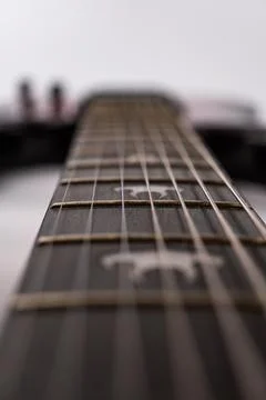 Close-up image of a modern heavy rock electric guitar, focusing on intricat.. 스톡 사진