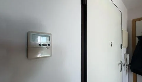 A close-up image of a modern keypad entry system designed for office enviro.. Stock Photos