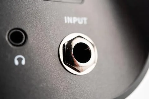 Close-up image of a modern mini guitar amp speaker and camera lens The guit.. Foto stock