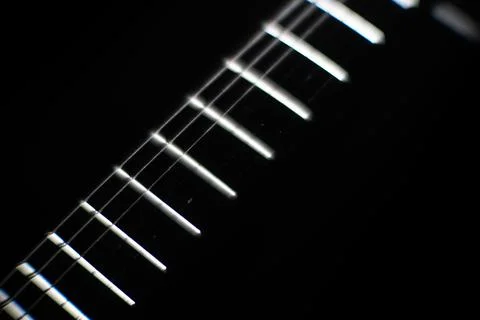 Close-up image of a multi-string musical instrument guitar or bass guitar, .. Foto stock