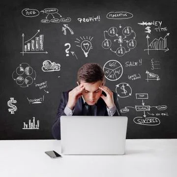 Close up image of multitasking business man using a laptop and mobile phone Foto stock