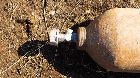A close up image of an old rusted propane cylinder shut off valve Stock Photos