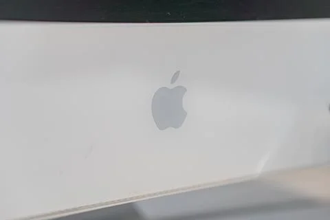 Close-up image of an old-style silver Apple computer from above, featuring th Stock Photos