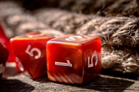 Close-up image of orange dice Stock Photos