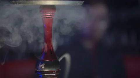 Close-up image of a part of a hookah with swirling smoke from it. Stock Footage 145151732
