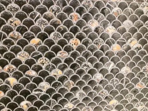 Close-up image of a patterned collection of circular metallic objects, possib Stock Photos
