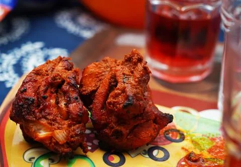 Close up image of a piece of fried and roasted chicken tandoori breast piece.Its Stock Photos