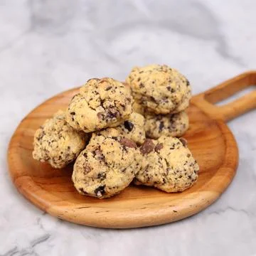 A close-up image of a pile of rustic-style chocolate chip cookies Stock Photos