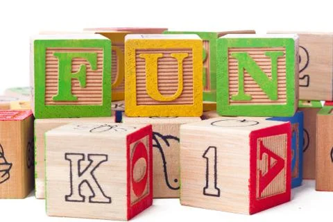 Close up image of playing cubes arranged to form a word fun Stock Photos