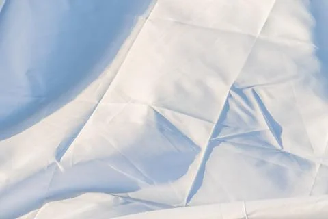 Close-up image of a pleated white textile with subtle shading, focusing on .. Stock Photos