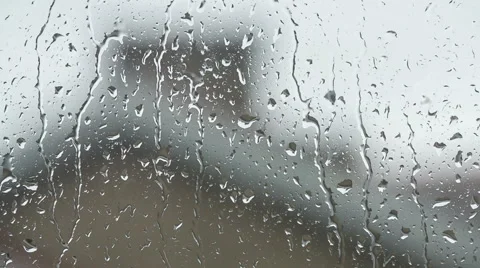 Close up image of rain drops falling on a window Stock Footage 45292441