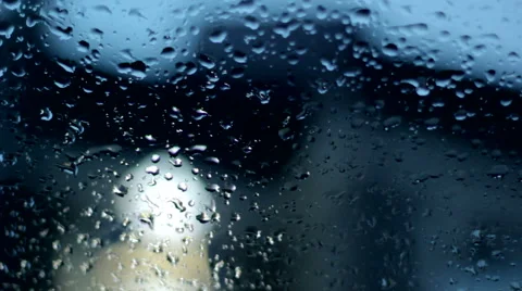 Close up image of raindrops falling on a window Stock Footage 43768113