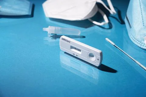 Close up image of Rapid test kit device for Covid-19 showing positive result. Stock Photos