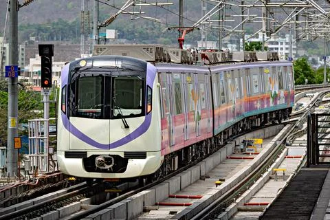 Close up image of Rapid transit metro train entering Vanaz station in Pune. T Stock Photos