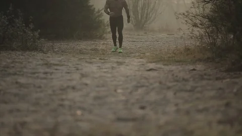 Close up image runner legs of nandsome caucasian athlete in running shoes and Stock Footage 125866224