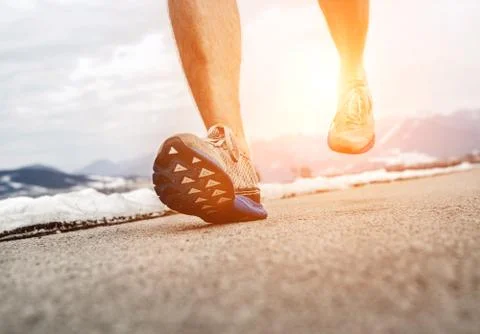 Close up image runner legs in running shoes Stock Photos
