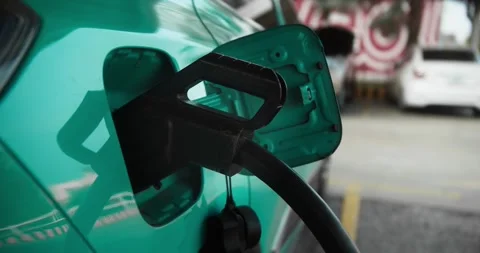 This close-up image shows the birch colored electric vehicle charging port Stock Footage 306961863