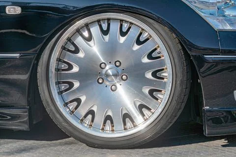 Close-up image of a silver hubcap, centered on a circular design with multipl Stock Photos