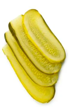 Close up image of slice of pickles against white background Stock Photos