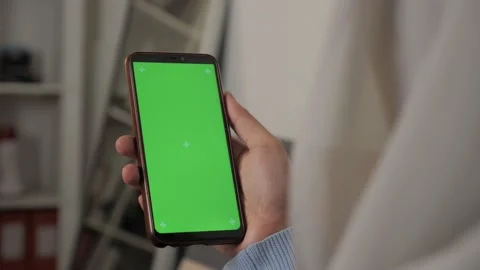 Close up image of smart phone mockup, woman holding phone with green screen Stock Footage 146102557