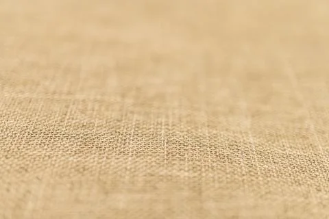 Close-up image of soft, light beige fabric with subtle weave pattern could be Stock Photos