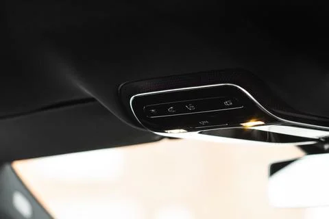 Close up image of the SOS button and car ceiling lamp in a car. Foto stock