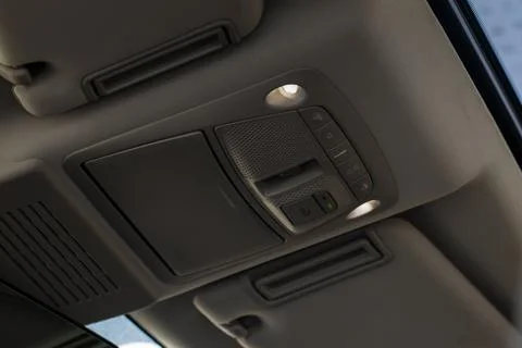 Close up image of the SOS button and car ceiling lamp in a car. Foto stock