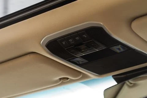 Close up image of the SOS button and car ceiling lamp in a car. Stock Photos