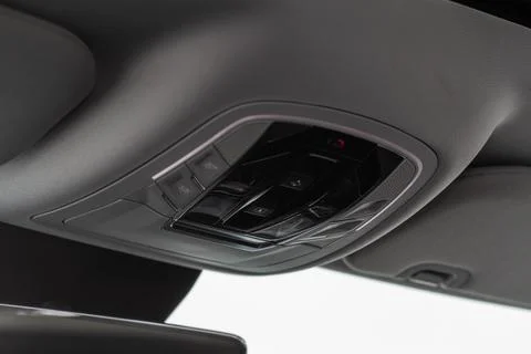 Close up image of the SOS button and car ceiling lamp in a car. Foto stock