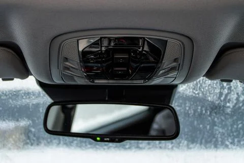 Close up image of the SOS button and car ceiling lamp in a car. Stock Photos