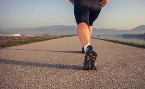 Close up image sprinter warming up legs Stock Photos