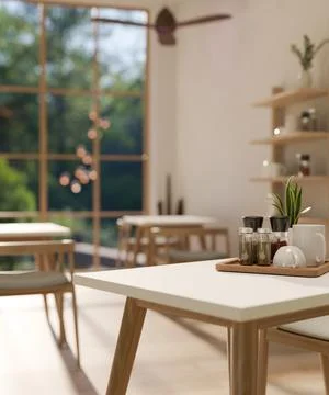 Close-up image of a table in a modern, cosy, Scandinavian restaurant or cafe. Illustrazione stock