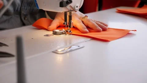 Close-up image of tailor sewing on sewing machine. Tailoring Process. Stock Footage 313924209
