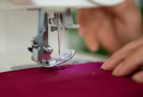 Close-up image of tailor sewing on sewing machine Stock Photos