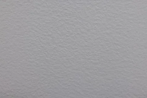 Close-up image of a textured white wall surface with subtle lighting Stock Photos