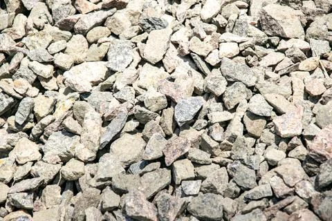 Close-up image of various sizes of grey and pink gravel stones Stock Photos