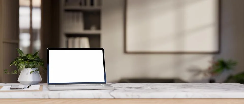 Close-up image of a white-screen laptop mockup on a white marble tabletop i.. Stockillustratie